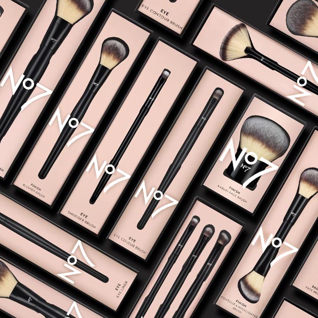An array of No7, Number Seven, cosmetic brushes inside pink packaging. Boots beauty accessories.