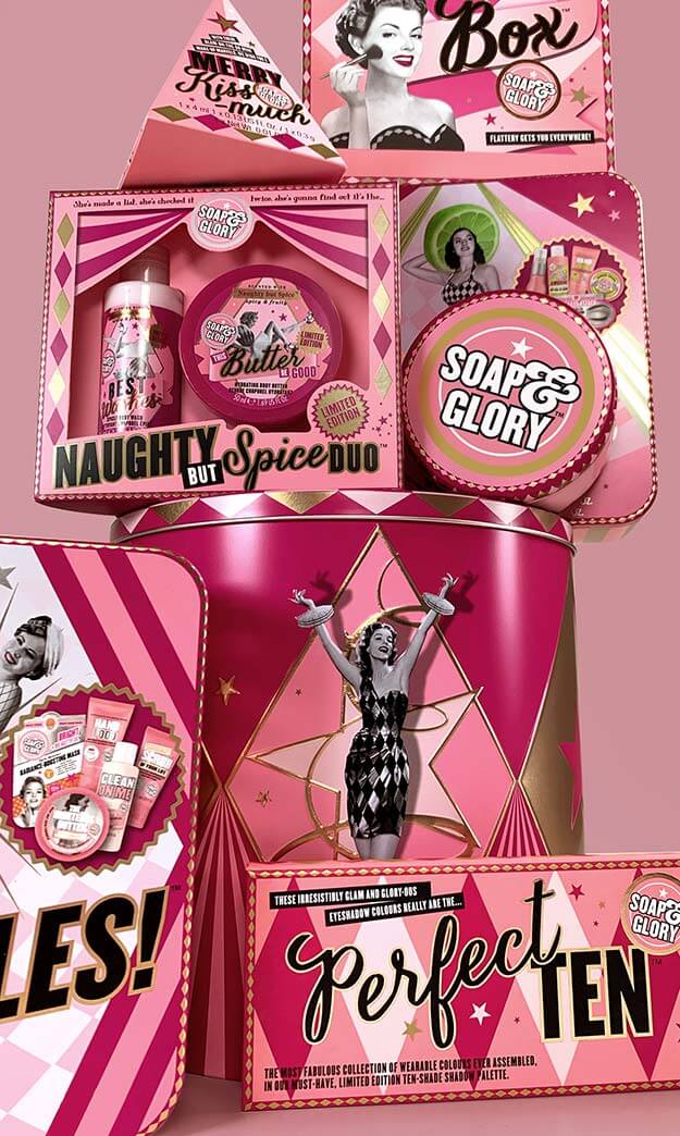 A tall tower of stacked Soap & Glory Christmas 2018 gift packaging. Show time theme. Multiple formats.